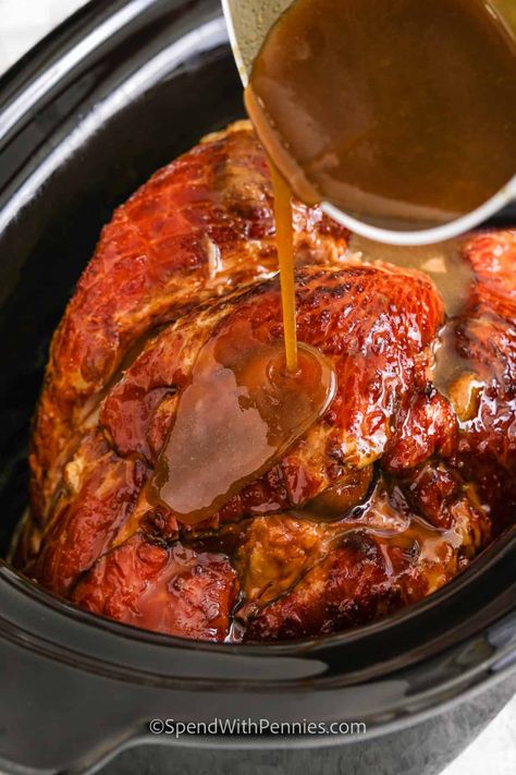 Crock Pot Ham makes a fantastic holiday ham! The slow cooker does the heavy lifting, glazing it with brown sugar and jelly, resulting in a tender and delicious meal that's easy to pull off. Whip it up for a simple main dish at holiday dinners or even cozy Sunday family meals! #crockpotham #slowcookerham #ham #spendwithpennies Ham In The Crockpot, Cooking Ham In Crockpot, Slow Cooker Ham Recipes, Precooked Ham, Ham Recipes Crockpot, Bisque Soup Recipes, Holiday Ham Recipes, Ham Recipes Baked, Ham Glaze Recipe