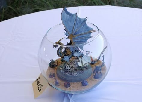 fishbowl centerpieces Dnd Centerpiece, Dnd Wedding, Fishbowl Centerpiece, Medieval Wedding Theme, Wedding Reception Tables Centerpieces, Centrepiece Ideas, Gamer Wedding, Reception Table Centerpieces, Dragon Wedding