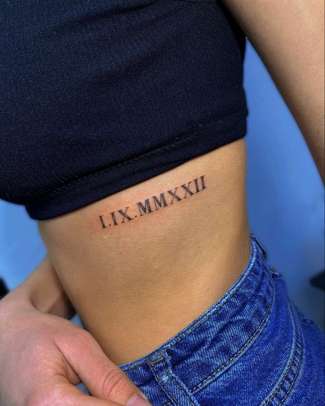 Date Of Birth Tattoos Ideas Roman Numerals, Ribcage Roman Numeral Tattoo, Roman Numeral Tattoo Ribcage, Collarbone Tattoo Roman Numerals, Roman Numerals Rib Tattoo, Roman Numeral Tattoo On Ribs, Rib Tattoo Roman Numeral, Roman Numeral Tattoo Font Style, Roman Numeral Tattoos Women