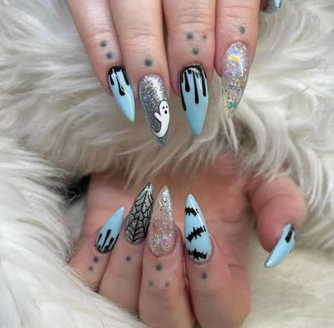 40 halloween nail ideas for the 2024 spooky season you're actually gonna like 25 Royal Blue Halloween Nails, Baby Blue Halloween Nails, Teal Halloween Nails, Halloween Blue Nails, Light Blue Halloween Nails, Blue Spooky Nails, Dark Blue Halloween Nails, Cartoon Halloween Nails, Halloween Nails Blue