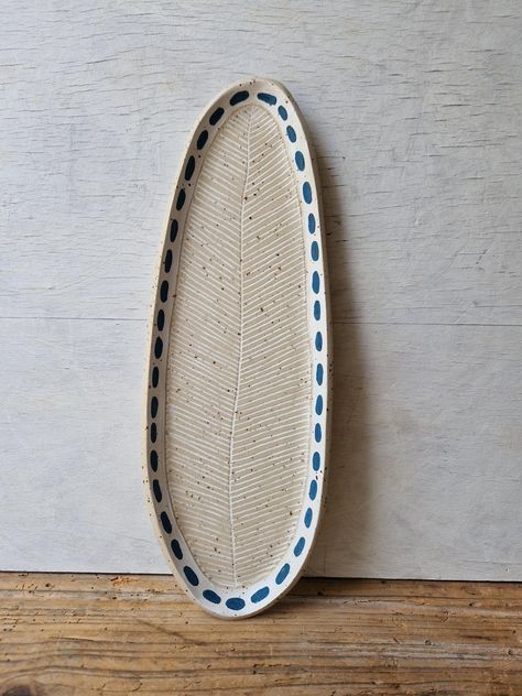 Lovingly handmade oval ceramic platter to serve your delicious food or simply for decoration to bring more beauty to your home!  MATERIALS Durable speckled stoneware clay, engobes, food safe glazes.  DIMENSIONS cca. 32cm long, 18cm wide. MAKING TECHNIQUE slab-building Dishwasher safe. Microwave safe. CONDITION OF THE PRODUCTS Because all our pieces are handcrafted, there may be minor variations form item to item. Hand Built Serving Platter, Oval Plates Ceramics, Ceramic Platters Handmade, Ceramic Trays, Ceramic Serving Platter, Speckled Stoneware, Ceramic Platter, Pottery Platter, Cement Art