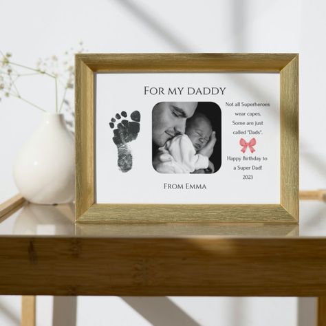 Celebrate a new dad's superhero status with a custom gift! This footprint frame with a picture is the perfect present for Father's Day. Get the printable and create a heartfelt keepsake for the proud father in your life. Newborn Footprint Art, Baby Handprint Crafts, Baby Footprint Art, Fathers Day Poems, Gift For New Dad, Father's Day Printable, Mother Poems, Baby Handprint