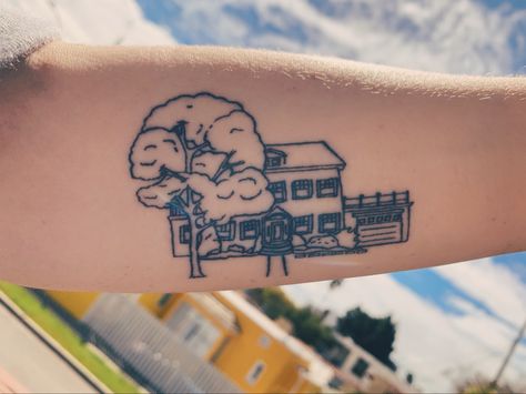 Fine line tattoo of house with front yard and tree on forearm Outline Of House Tattoo, Childhood House Tattoo, Childhood Home Tattoo Ideas, Fine Line House Tattoo, Table Tattoo Design, Childhood Home Tattoo, House Outline Tattoo, Address Tattoo, Cottage Tattoo