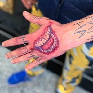 Jokers Smile Tattoo On Hand, Joker Mouth Hand Tattoo, Joker Smile Tattoo Design, Joker Mouth Tattoo On Hand, Joker Hand Tattoo Design, Tattoo Designs Joker, Joker Mouth Drawing, The Joker Hand Tattoo, Joker Smile Hand Tattoo For Women