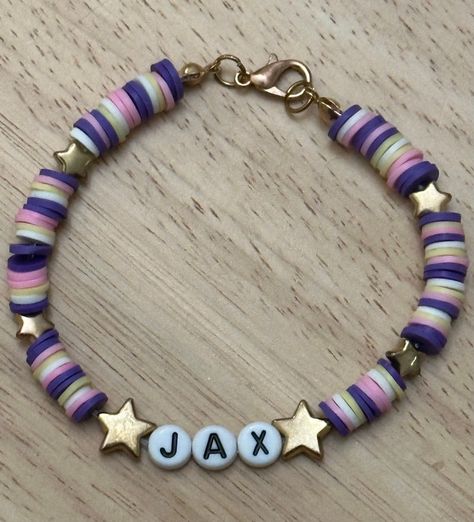 1 Handmade Jax bracelet, from The Amazing Digital Circus show. The colors match the character and his outfit. (ONLY 1 JAX BRACELET INCLUDED) The bracelet includes polymer clay beads, gold charms, and clasp. Bracelet Ideas Clay Beads, Polymer Clay Charm Bracelet, Circus Show, The Amazing Digital Circus, Polymer Clay Bracelet, Amazing Digital Circus, Clay Bracelet, Gold Charms, Polymer Clay Charms