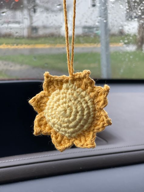 These adorable handmade crochet Sun ☀️ car hangers are crafted with care and attention to detail.  Ideal for any age driver who wants some Sunshine in their vehicle.  Cute gifts for her! Made with 100% cotton yarn and two different color yellows.  For any questions or concerns, please don't hesitate to contact me. I am here to assist you and ensure your complete satisfaction with your purchase! Dementions - Sun 2 1/2 X 2 1/2 Car Dangle Crochet, Rearview Mirror Crochet Patterns Free, Crochet Rear View Mirror Accessories, Crochet For Car Accessories, Car Mirror Hangers Crochet, Crochet Car Dangles, Crochet Car Hangers, Crochet For Car, Car Charms Diy