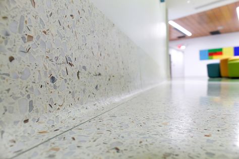 Add the finishing touch to your terrazzo floor with Venosa’s terrazzo base. Our custom straight and cove base can be produced at any height to meet your projects requirements. Cove base comes with an available option for a toe strip, and all of our base is finished with a decorative eased edge detail. For more … Continued Foresso Timber Terrazzo, Terrazzo Vinyl, Terrazo Flooring With Brass Inlay, Coloured Terrazzo, Terrazzo Texture Beige, Terrazzo Wall, Cove Base, Terrazzo Flooring, Baseboards