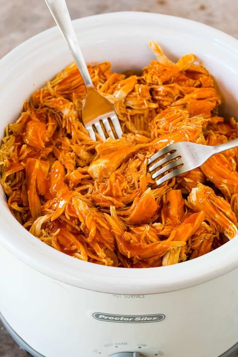 This crock pot buffalo chicken is chicken breasts cooked to tender perfection in a mixture of hot sauce, ranch seasoning and butter. Shred this slow cooker chicken and serve it as-is, on a sandwich or as a salad topper. Barbeque Chicken Recipes, Braised Chicken Breast, Bbq Chicken Recipe, Barbecue Chicken Recipe, Slow Cooker Teriyaki Chicken, Bbq Chicken Breast, Slow Cooker Bbq Chicken, Slow Cooker Bbq, Bbq Chicken Recipes