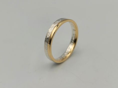 "This is a two tone hammered ring which consists of one ring made of sterling silver and another made of 14K gold which have been soldered together. The silver is hammered and the gold part in contrast is glossy. A unique wedding ring comfortable to wear from men and women! It is a made of order ring and you can choose either 4.5mm width as a wider option or 3.5mm width a thinner one. The first has 3.0mm sterling silver and 1.5mm 14K gold and the thinner has 2.00mm silver and 1.5mm 14K gold. DET Mens Wedding Rings Gold And Silver, Wedding Ring Mixed Metals, Mixed Metal Wedding Bands, White And Yellow Gold Ring, Silver And Gold Jewelry Mixing Rings, Male Engagement Ring Men, Mixed Metal Wedding Ring, Gold And Silver Wedding Band, Silver And Gold Jewelry Mixing