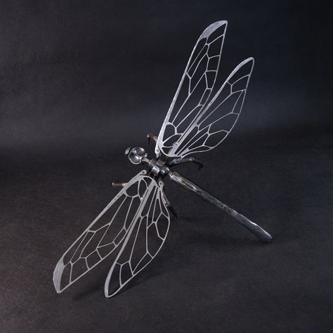 The dragonfly is suitable as a decorative sculpture, for example, in a gazebo, in a winter garden or anywhere in your house. Not intended out. If you are interested in the outdoor variant, choose Dragonfly for the exterior, which I also offer. Body length approx. 30 cm, wingspan 50 cm. The body and head are forged from one piece, full of material. The wings are laser cut, then forged and riveted to the body. Metal Wire Sculpture, Diy Tie Dye Designs, Dragon Flys, Dragonfly Ornament, Metal Sculptures Garden, Dragonfly Decor, Dragonfly Wings, Animal Symbolism, Dragonfly Art