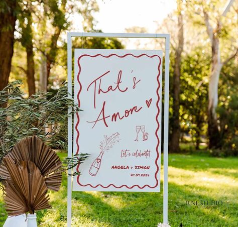 Unique Engagement Party Welcome Sign Hand written Hand-painted Pizza Rehearsal Dinner Welcome To our engagement Decor Couple Shower Pizza Theme Wedding DIY Bridal Shower Bachelorette Party Adult Birthday Welcome Board Hens Party Decoration -------------------- The listing is for Hand drawn That's Amore Engagement Party Wedding Welcome Sign Template. This design features my hand lettered "That's Amore" and trendy illustration style with champagne bottle, engagement ring and wavy border, a great w Laid Back Engagement Party, Thats Amore Sign, Italian Style Engagement Party, Bbq Welcome Party, Bridal Shower Valentines, Minimalist Engagement Party Decor, Perfect Pair Engagement Party, Italian Wedding Welcome Party, Backyard Fall Engagement Party