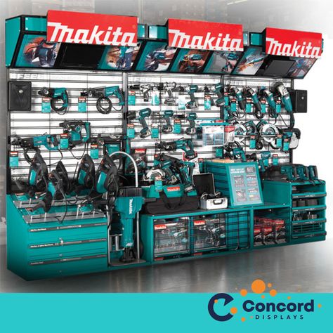 Does your retail display interact with all five of your customer's senses? This display we created was truly immersive. First, this display is an interactive touch and feel display. There are video screens at the top left and right, and Kicker speakers on each side (Makita partnered with Kicker speakers for this display). The Makita logos are lit up. Originally, Makita had 22 wire tool holders to hold all the types of tools they wanted to include in their display, but in the final version, we s Napa Auto Parts Store, Ryobi Power Tools, Tool Display, Power Tools Design, Power Tool Storage, Shop Facade, Japanese Woodworking, Tool Store, Cordless Power Tools