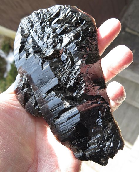 Offering a complete black quartz floater. Highly lustrous Black Jacaré Quartz crystal. Morion quartz differs from the common quartz mineral due to its aluminum content. In fact, aluminum is the root cause of its light-absorbing characteristic, which causes a jet-black coloration. The crystal face is intact with interesting termination formations on back. 6 inches tall. 100% crystallized floater with NO damage. Mined Galilea, MG Brazil. Morion Quartz, Quartz Mineral, Fine Minerals, Black Quartz, Phantom Quartz, Peach Blossoms, Vintage Bar, Weird And Wonderful, Smokey Quartz