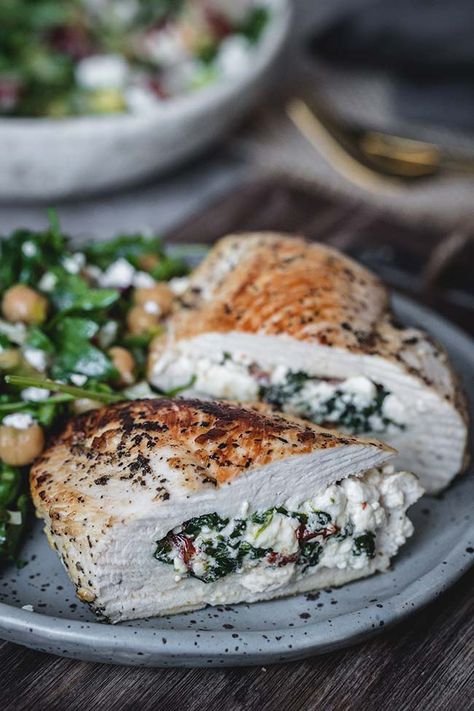 Simple chicken breasts get a flavorful upgrade with this spinach and feta stuffed chicken. Sun-dried tomatoes, fresh spinach, and salty feta cheese combine to make a delicious, creamy filling that will make tonight’s chicken dinner a special one. #chicken #spinach #dinner #healthy #feta Nightly Meals, Mushroom Stuffed Chicken Breast, Stuffed Chicken Breast Recipes, Feta Stuffed Chicken Breast, Tuscan Shrimp, Ricotta Stuffed Chicken, Fitness Meals, Spinach Cheese, Feta Chicken