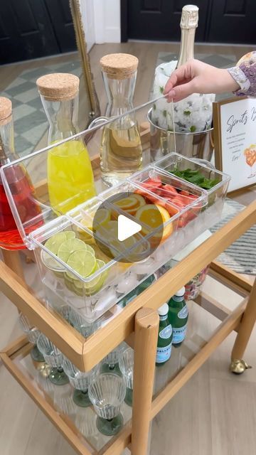 Carol & Ale on Instagram: "Easy DIY SPRITZ BAR 🍋🍋‍🟩 perfect idea for your next party! Comment SPRITZ and we’ll send you a DM to shop everything we used, or click our link in bio

We always put together this cute spritz bar and our guests LOVE it! We use this chiller to add our favorite citrus, berries and mint, and these beautiful glass bottles to serve Aperol, Limoncello and Elderflower liquor. We use our favorite wine chiller for our prosecco, and also add an ice bucket, sparkling water and glasses so our guests can create their own spritz. 

Make this for your next party!

#mimosabar #entertainingathome #spritzbar #entertaininginstyle #outdoorentertaining #outdoorentertainment
#creativerecipes #creativeideas #outdoorliving #partyideas #homeblogger #barcartstyling #barbecueparty #brid Spritz Bar Ideas, Prosecco Bar Ideas, Elderflower Liquor, Aperol Spritz Bar, Spritz Bar, Diy Cocktail Bar, Prosecco Bar, Birthday 30, Hosting Ideas