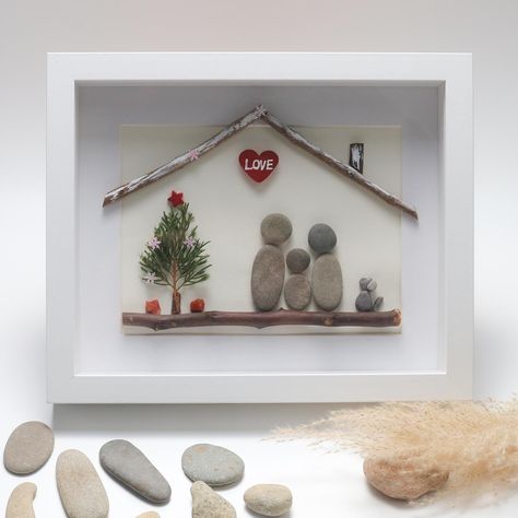 Personalised Family Christmas Pebble Art, Christmas Family Pebble Art Wall Decoration, Pebble Art Gift for Christmas, Gift for Family Exquisite Family Keepsake: Handcrafted Pebble Art that Captures the Heart of Your Loved Ones Handcrafted: Each piece is meticulously handcrafted with the utmost care and attention to detail, ensuring a truly unique masterpiece that beautifully captures the essence of your family. The skilled artisan's touch brings your loved ones' story to life through the thoughtful arrangement of natural pebbles and driftwood. Natural: Crafted from carefully selected natural materials, including pebbles and driftwood, the pebble art piece embodies the beauty and serenity of the natural world. The organic elements harmoniously blend to form a heartwarming scene that symboli Pebble Art Christmas, Christmas Pebble, Family Pebble Art, Christmas Pebble Art, Christmas Gift For Family, Pebble Art Family, Organic Elements, Sea Glass Crafts, Family Keepsakes