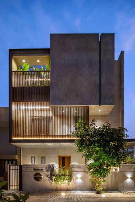 Dusk light exterior view of Manilaxmi by I K Architects House Elevation Lighting Design, 4 Storey Commercial Building Design, Residence Facade Design, Brick And Concrete Facade, Modern Bungalows, Villa Elevation, Farm Furniture, Exterior Lighting Design, Elevation Ideas