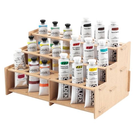 Mezzo Straight Rack 2, Artist Paint Rack - Upright, Easy to view, Paint and Brush Organizing System Upright, Easy to view, Paint and Brush Organizing System - Buy Direct & Save More! The Mezzo Paint Racks offer a simple solution for studio organization. The rack helps you to organize your paints while also making it easy to grab what you need while painting. The unique pairs of football-shaped holes and bottom slots allow you to display paint tubes upright in a variety of sizes. The Mezzo allows you to focus on the paints you are using by making them more visible. You could even use multiple sets to display and organize a larger collection of paints. The configuration possibilities are endless! Mezzo Straight Rack 2, Artist Paint Rack Key Features: Easy assembly Upright, easy to view, orga Artist Studio Storage, Brush And Paint, Artist Storage, Paint Tube, Studio Storage, Professional Art Supplies, Paint Rack, Wooden Tool Boxes, Drawing Desk