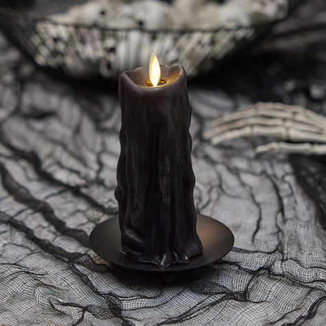 PRICES MAY VARY. Our Black Wax Heavy Drip Flameless Candle Pillar was especially designed to mirror the beautiful natural flow of running wax from traditional burning candles. Thick layers of Black melted wax cascade down the pillar to create a very realistic dripping wax effect and cast a beautiful flickering light without any safety concerns. Arrange this candle with other pillars in varying sizes or make it the centerpiece of a tray or candelabra. This eerie pillar accentuates Halloween decor Black Candle Spells, Candle Wax Dripping, Luminara Candles, Timer Candles, Candle Dressing, Thick Layers, Dripping Candles, Burning Candles, Easy Candles