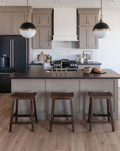 Kitchens of Instagram | Taupe cabinets and these stunning black countertops are a match made in Heaven 😇 ⁠ ⁠ @hellomillerdesign @rhseriesbycaliber @caliberhomes... | Instagram Taupe Cabinets, Monochromatic Kitchen, Taupe Kitchen Cabinets, Black Soapstone, Taupe Kitchen, Black Countertop, Kitchen And Pantry, Transitional Interior Design, Black Countertops