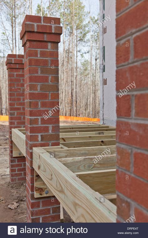 New home construction wood framing details of a porch with brick columns Stock Photo Brick Post Columns, Brick Columns Porch, Brick Pillars Porch, Stairs Backyard, Brick Pillars, Brick Porch, Brick Columns, Wooden Columns, House Front Porch