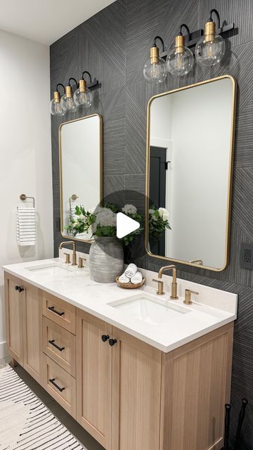 Karey + Justin | Home Build | Home Design | Home Life on Instagram: "First peak at our basement bathroom.  We went for a modern take with neutral colors. Glass shower door on order. Stay tuned for that!  Who else is obsessed with the charcoal tile wall? 🙋🏻‍♀️ We wanted a little moody but not too dark since there is no natural light.   Tile: by @tilebar (Enso, Kenridge, and Portmore). Vanity: by @teodorvanities  Paint: SW pure white Floor: concrete with overlay  Comment LINK for details to be sent your way.  Must be following for links to be sent correctly.   #modernfarmhouse #interiordesign #moderntransitionaldesign #customhome #buildtips #newbuild #homedecor #basementbathroom #neutralbathroom #woodlooktile #blackwalltile #portmore #kenridge #enso #tilebar #whiteoakvanity" Bathroom Dark Walls Light Floor, Modern Bathroom Dark Floor, Bathroom Dark Floors Light Walls, Light Floor Dark Walls Bathroom, Charcoal Accent Wall Bathroom, Charcoal Wall Bathroom, Black Tile Behind Vanity, Moody Ensuite Bathroom Ideas, Bathroom With Black Accent Wall