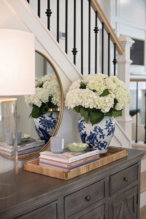 https://pin.it/3uzBRjHJK Entry Table Tray, Chinoiserie Entry Table, Console Tray Decor, Console Table Next To Stairs, Chinoiserie Farmhouse Decor, White And Blue Vase Decor, Grand Millenial Foyer, How To Add Seating In Small Living Room, Chinoiserie Vase Decor