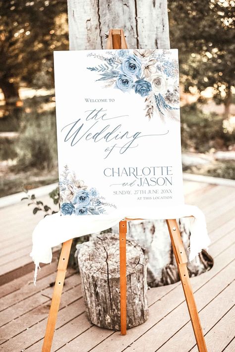 Boho Dusty Blue Wedding Welcome Sign Template, Floral Welcome Sign Editable Welcome to Our Wedding Sign Blue Wedding Signage D010 Step into a realm of refined elegance and natural beauty with our exquisite Blue Wedding Welcome Sign Template. This template perfectly captures the essence of Bohemian and Rustic themes, embodying the enchanting spirit of fall through its captivating Green and White color palette adorned with graceful Pampas Grass motifs. What distinguishes our Welcome Sign Template Navy And Dusty Blue Wedding Decor, Dusty Blue And Gray Wedding Theme, Light Blue Rustic Wedding, Dusty Blue And Champagne Wedding, Blue Wedding Signage, Light Blue And Gold Wedding, Wedding Welcome Sign Blue, Dusty Blue Fall Wedding, Dusty Blue Boho Wedding