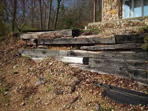 Rather than repairing a failing wood wall, replacing it with a dry-laid modular concrete-block system is a more durable option. How To Fix Retaining Wall, Fix Retaining Wall, Retaining Wall Repair, Timber Retaining Wall, Wooden Retaining Wall, Railroad Tie Retaining Wall, Wood Retaining Wall, Railroad Tie, Backyard Retaining Walls