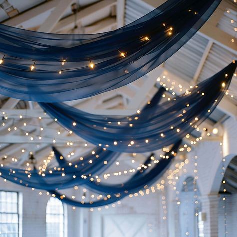 Transform Your Event With Our 5ftx32ft Navy Blue Chiffon Ceiling Drapery. Elegant, Versatile, And Easy To Install. ✓ Get Yours Today! Elegant Blue Party Decorations, Dark Blue Balloon Decorations, Starry Night Wedding Backdrop, Ceiling Drapery Hanging, Starry Night Wedding Decorations, Under The Stars Party Ideas, Gala Ceiling Decor, Into The Stars Prom Theme, Navy Blue And Pink Sweet 16