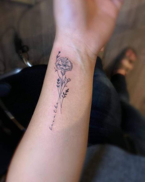 Inspirational Forearm Tattoos For Women, Places For Flower Tattoo, Best Place For Flower Tattoo, Yellow Marigold Tattoo, Words Into Flower Tattoo, Flowers With Words Tattoo, Flower On Wrist Tattoo, Even If Tattoo, Tattoos For My Mom