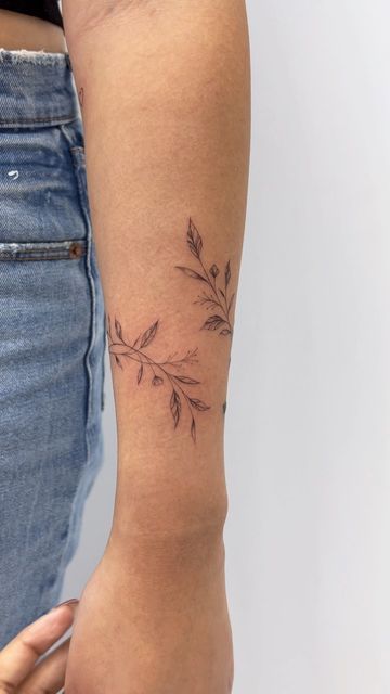 Dainty Flower Arm Tattoos For Women, Dainty Floral Tattoo Design, Fineline Flower Tattoo Arm, Leafy Wrap Tattoo, Dainty Flower Wrap Tattoo, Flower Fine Line Tattoo Arm, Simple Floral Arm Tattoo, Bracelet Arm Tattoo, Leafy Floral Tattoo