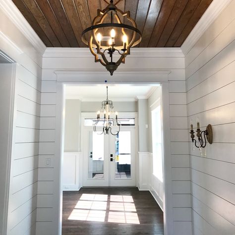 Jennifer Taylor Design - entry, shiplap, stained wood ceiling, modern farmhouse Farmhouse Foyer Lighting, Lighting Entryway, Farmhouse Foyer, Ship Lap, Foyer Lighting, Wood Ceiling, Unfinished Basement, Painted Wood Signs, Living Room End Tables