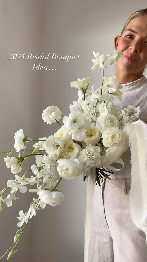 Morgan Cullimore┋ Florist | ✨2024 Bridal Bouquet Inspo ✨ The classic, all white bouquet … with a slight cascade ;) What do we think?!? 🤩 anyone doing white for… | Instagram Horizontal Bridal Bouquet, White Ohara Rose Bouquet, Big White Bridal Bouquet, Summer White Wedding Flowers, Unique White Bridal Bouquet, Flower Bouquet Wedding White, Big White Bouquet, Diy White Rose Bouquet, Bride Bouquets Cascade