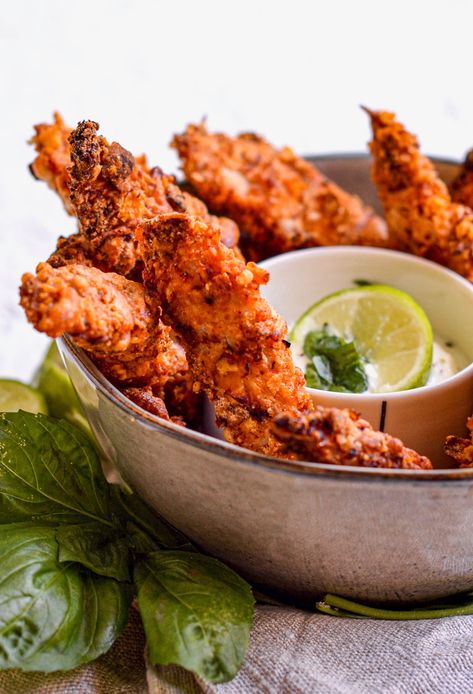 Chicken tenders never tasted so good! This baked chicken fingers recipe is so finger lickin' good and so easy to make for a tasty meal, appetizer or finger food. Served with a creamy yogurt dip, you are going to love these super crispy bites! Baked Chicken Fingers, Easy Chicken Lettuce Wraps, Chicken Fingers Recipe, Easy Chicken Tetrazzini, Chicken Fingers Baked, Baked Chicken Strips, Chicken Finger Recipes, Chicken Strip Recipes, Lime Chicken Recipes