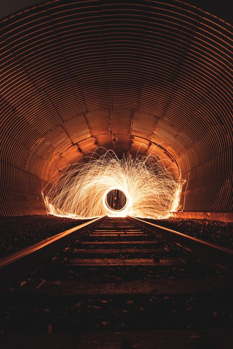 Creative steel wool photography on train tracks.. Download this photo by Andre Frueh on Unsplash Wool Photography, Steel Wool Photography, Creative Photography Ideas, Light Painting Photography, Photography Ideas At Home, Fire Photography, Light Trails, Best Iphone Wallpapers, Steel Wool