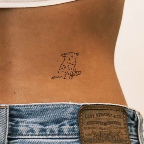 Charming Small Cow Tattoo Ideas 2024: Cute & Creative Inspirations for Women Small Cattle Skull Tattoo, Quokka Tattoo Small, Animal Tattoos Designs, Cute Small Simple Tattoo Ideas, Cow Wearing Cowboy Hat Tattoo, Cow Small Tattoo, Cow Inspired Tattoo, Cow Finger Tattoo, Dainty Bull Tattoos