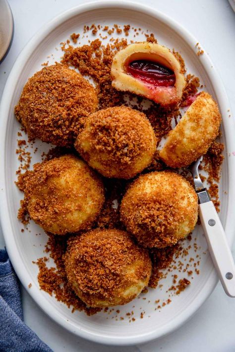 Plum Dumplings with Ricotta is a delicious dessert. You can use your favorite fruits in this simple family favorite recipe. They are well known in Austria, Poland, and over here in Slovenia. Kids and adults love them and you can easily make them up to three months ahead. #jernejkitchen #plumdumplings #plumrecipes #autumnrecipes #ricotta #slovenianrecipes #dessert Easy Cultural Recipes, Baking With Fruit, Plum Recipes Dessert, What To Do With Plums, Recipes With Plums, Slovenia Recipes, Plum Dessert Recipes, Breakfast Dumplings, Ricotta Dessert Recipes