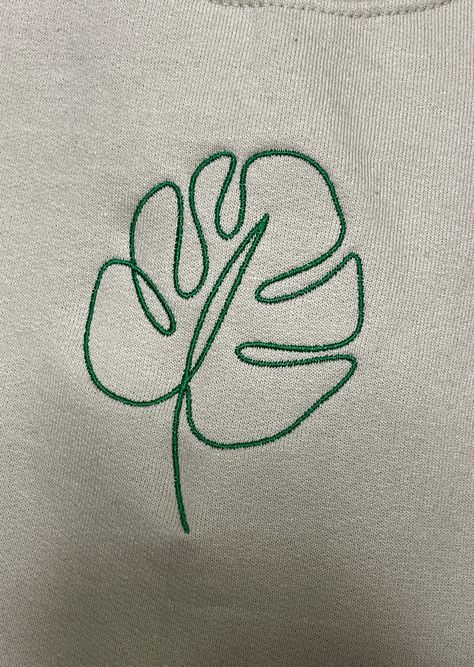 Photo features: Tan Sweatshirt x Green Thread ✰Embroidered, half of a set✰UNISEX✰Hand drawn and designed✰Super soft and comfy! Materials: 50/50 cotton poly blend *Sizes 2XL-3XL may be subject to longer processing times since we don't carry a large amount of inventory in those sizes, so we would have to put in a special order from our supplier! Thank you for understanding. Monstera Leaf Embroidery Pattern, Embroidery Plants Leaves, Green Embroidery Design, Male Embroidery Designs, Embroidery Monstera, Monstera Embroidery, Hoodie Outline, Turtle Embroidery, Embroidered Words