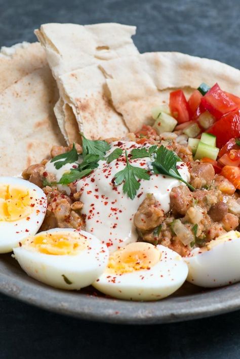 A trip to Cairo wouldn’t be complete without trying the ancient Egyptian breakfast staple, ful medames. To make the dish, the ‘fūl’ or beans are warmed and gently flavoured with cumin, onion, tomato, Egyptian Breakfast, Ful Medames, Lentil Dishes, Doner Kebab, Middle Eastern Dishes, Egyptian Food, Dinner Appetizers, Middle Eastern Recipes, Arabic Food