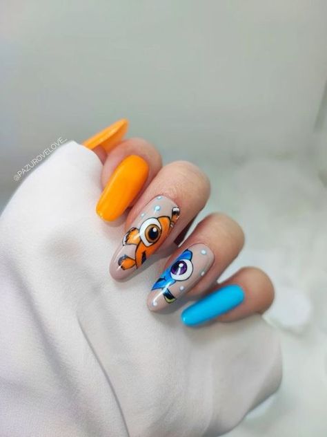 The Ultimate List of Disney Inspired Nail Designs To Save & Recreate! - The Catalog Nemo Nails Disney, Finding Dory Nails, Moana Nail Designs, Nemo Nail Art, Finding Nemo Nail Art, Bluey Cartoon Nail Art, Easy Cartoon Nails, Nails With Cartoon Characters, Nails Inspiration Disney