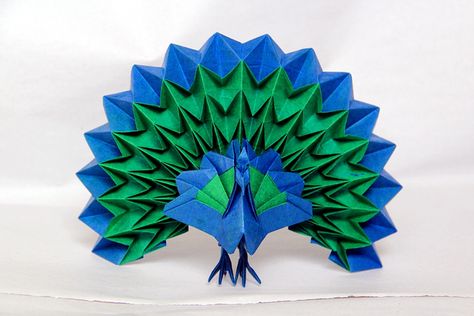 Origami peacock with fanned tail, made from one piece of uncut two-colored paper. Origami Peacock, Silhouette Cameo Projects Vinyl, Peacock Crafts, Indian Peacock, Origami Yoda, Bored Art, Origami Models, Origami Dragon, Origami For Beginners