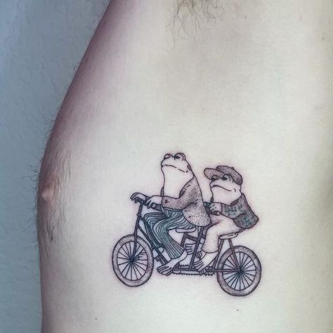 Izabella Tattoo Artist on Instagram: "FROG AND TOAD! I love this couple. There’s a super cute tiktok I made at the very end. I think I’m getting better at making them! Thank you @chasecaldwell__ for bringing me such a fun design and for staying so still! . . . #tattoo #tattoos #tattooart #tattooartist #tattooartists #atxtattoo #austintattooartist #finelinetattoo #finelinetattoos #frog #frogs #toad #frogandtoad" Frog And Toad Tattoo Small, Two Frogs In Love Drawing, Standing Frog Tattoo, Toad Mushroom Tattoo, Frog Couple Tattoo, Frog And Toad Matching Tattoo, Party Frog Tattoo, Frog And Toad Tattoos, Triassic Cuddle Tattoo