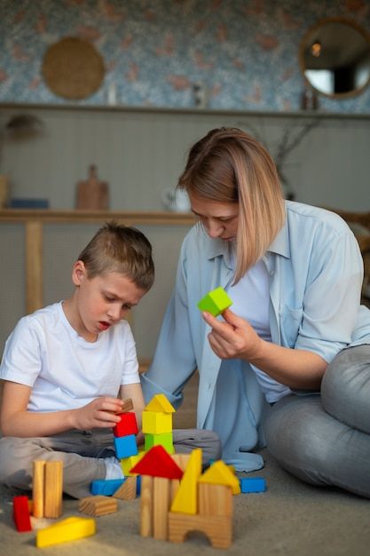 Free photo mother playing with her autis... | Free Photo #Freepik #freephoto #mom-son #mom-child #young-mother #asd Animation Classes, About Mother, Happy Parents, Mother Son, Boys Playing, Helping Children, Single Mothers, Working With Children, Children And Family