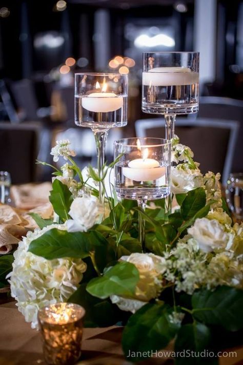 Stunning wedding table centerpiece idea and candles. Wedding Table Centerpieces Elegant, Votive Centerpieces, Floating Flower Candles, Candles And Flowers, Elegant Wedding Centerpiece, Tafel Decor, Simple Elegant Wedding, Flowers And Greenery, Wedding Table Flowers