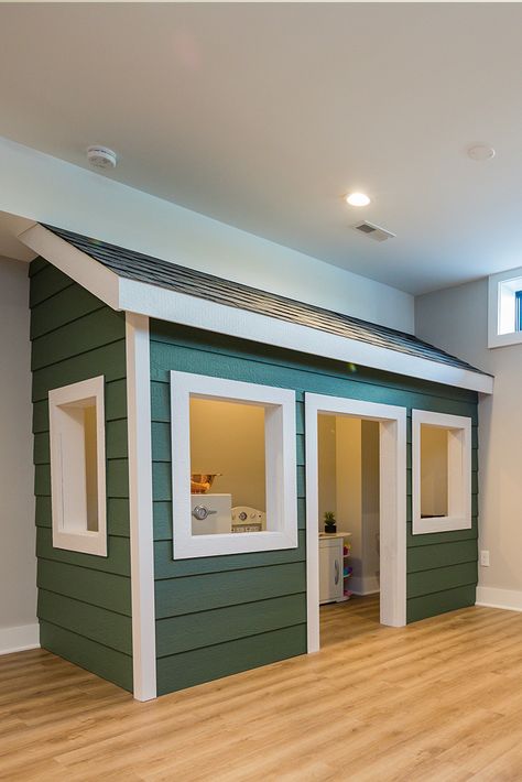 Give your children a splay area they'll never forget! This custom child's playhouse built into a wall of the basement is every kid's dream! Kids Playhouse Outdoors Girls, Kids Playhouse Outdoors Interior, Indoor Playroom Ideas, Kids Playhouse Ideas, Kids Playhouse Indoor, Outdoor Playhouse Plans, Playhouse Indoor, Kids Indoor Playhouse, Kids Playhouse Outdoors