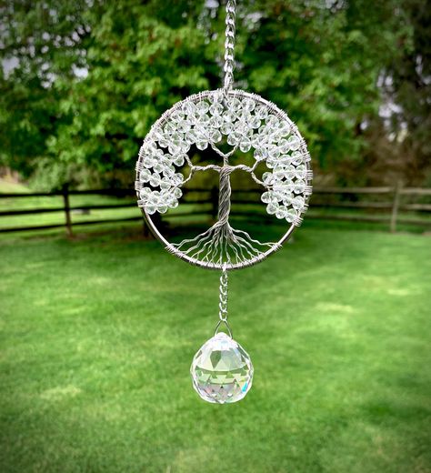 This crystal suncatcher wire tree of life is made with over 80 clear crystals and a beautiful large 30mm lead crystal ball prism.  The crystals are strung on silver wire on a 3 inch silver steel hoop to make this awesome tree.  The sun catcher is 8 inches long from top of the silver hook to bottom of crystal ball.  They come in an organza bag. Hang this sun catcher in any window to make beautiful rainbow prisms. **Since this is a made to order tree it may vary slightly from the pictures. Each tr Wire Tree Of Life, Beaded Suncatcher, Crystal Tree Of Life, Amethyst Chakra, Beaded Tree, Sending Good Vibes, Rainbow Prism, Wire Tree Sculpture, Personalised Family Tree