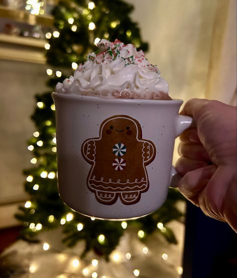 Gingerbread girl 

Hot chocolate 
Whipped creams 
Red and green sprinkles 
Christmas tree with lights as background Aesthetic Christmas Hot Chocolate, Hot Chocolate Christmas Aesthetic, Winter Hot Chocolate Aesthetic, Chocolate Caliente Aesthetic, Hot Chocolate Aesthetic Cozy, Christmas Hot Chocolate Aesthetic, Snow Aesthetic Pictures, Hot Chocolate Decorations, Aesthetic Hot Cocoa