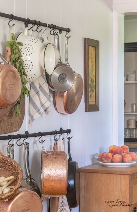 simple and thrifty hanging pot rack Display Copper Pots In Kitchen, Pans Hanging On Wall, Pots And Pans Wall Storage, Hanging Pans On Wall, Copper Pot Display, How To Hang Cast Iron Skillets On Wall, Hanging Mugs Under Cabinet, Hanging Pans In Kitchen, Hanging Pots And Pans On Wall