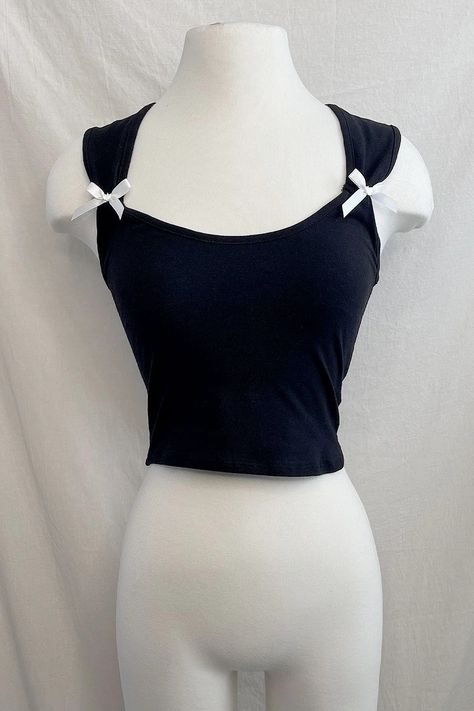 Slip into playful elegance with our Alanis Coquette Bow Top! The cropped sleeveless design features charming ribbon detailing on the side, adding a touch of coquettish flair. Perfect for a night out or a fun day with friends. Sleeveless Ribbon bow details Cropped Stretchy Imported 97% Cotton, 3% Polyester True to size Coquette Crop Top, Tops With Bows, Bow Clothes, Youtuber Dr, Coquette Top, Ribbon Top, Day With Friends, Dr Closet, Bow Top